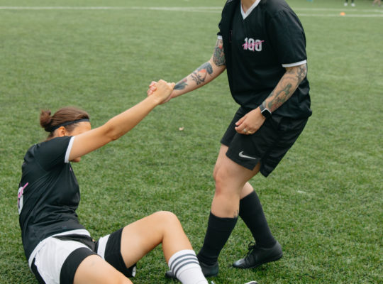 athlete injured getting helped up