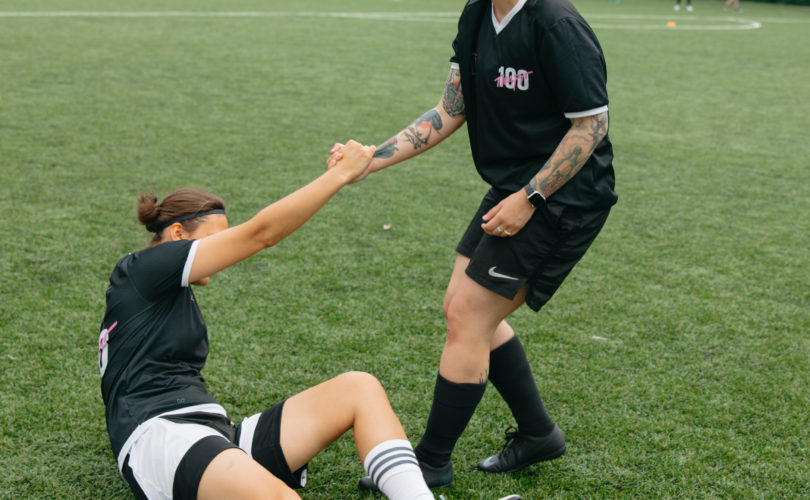 athlete injured getting helped up