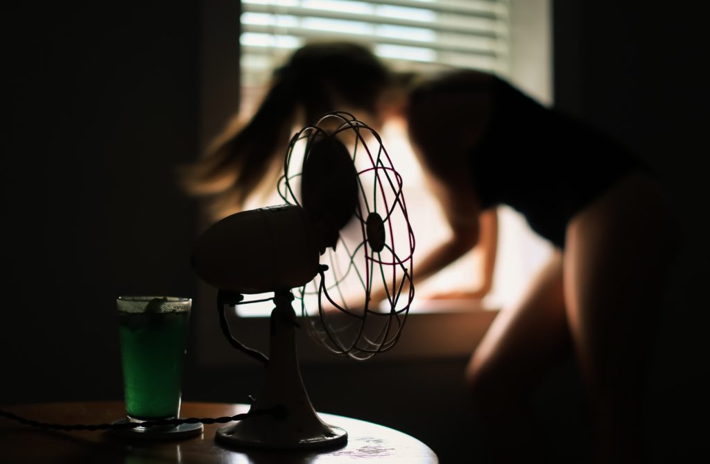 woman using fan 