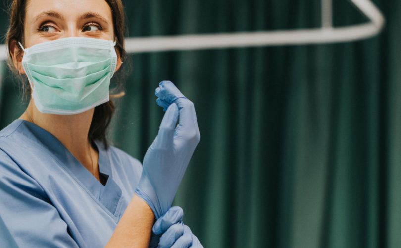 woman wearing nitrile gloves