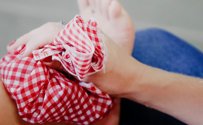 applying icepack to ankle
