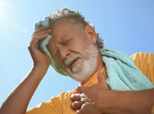 older man suffering from heat stroke or heat stress
