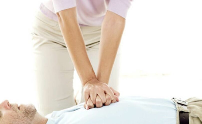 woman doing cpr on a man-01